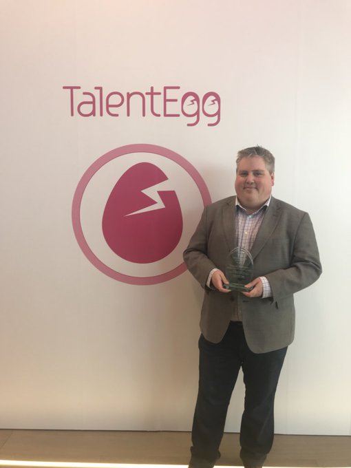 Trevor with Award